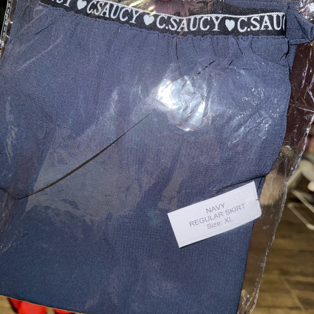C. Saucy Navy Skirt XL